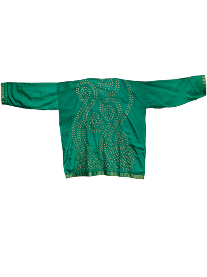 Green tunic and agold patterns on a white background 