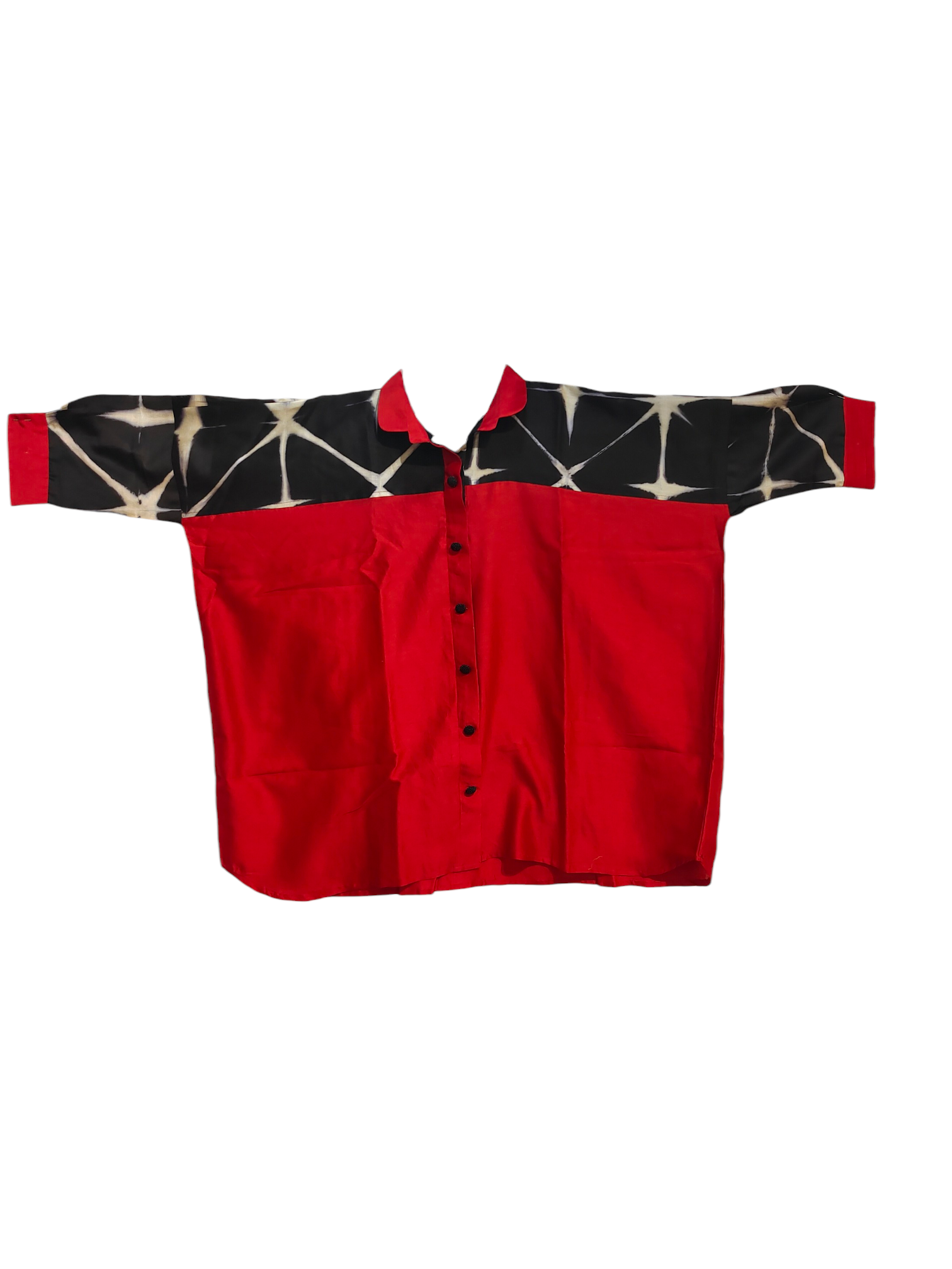 Red shirt with black and white pattern on sleeves and collar against a white background