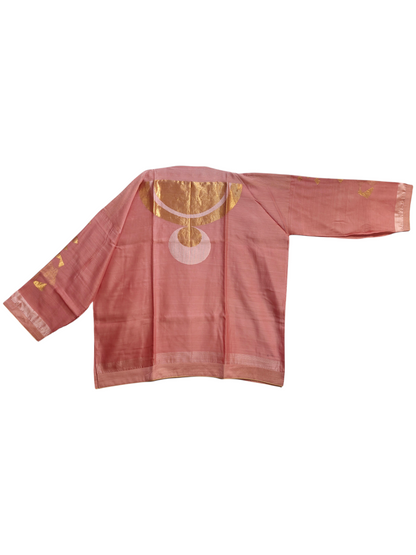 Pink traditional garment with gold and white patterns on a white background