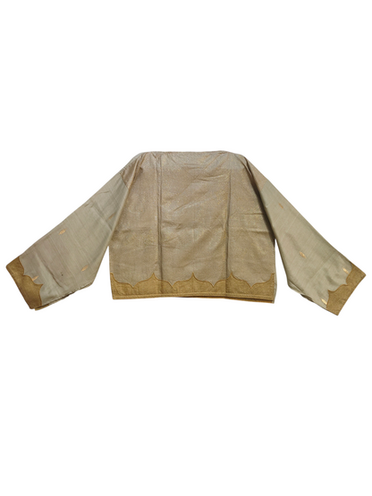 Beige blouse with gold trim on a white background