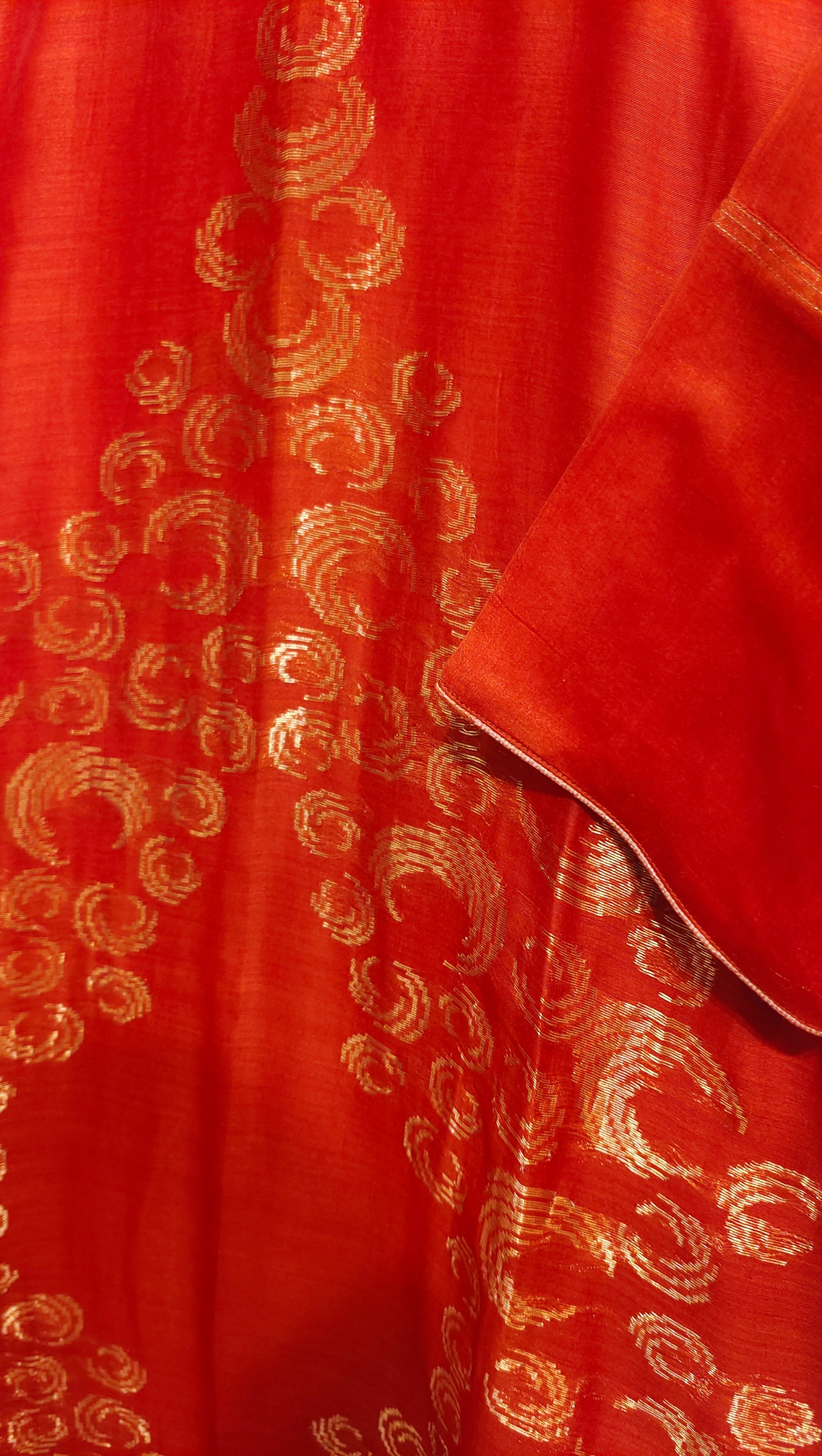 Red fabric with gold intricate patterns