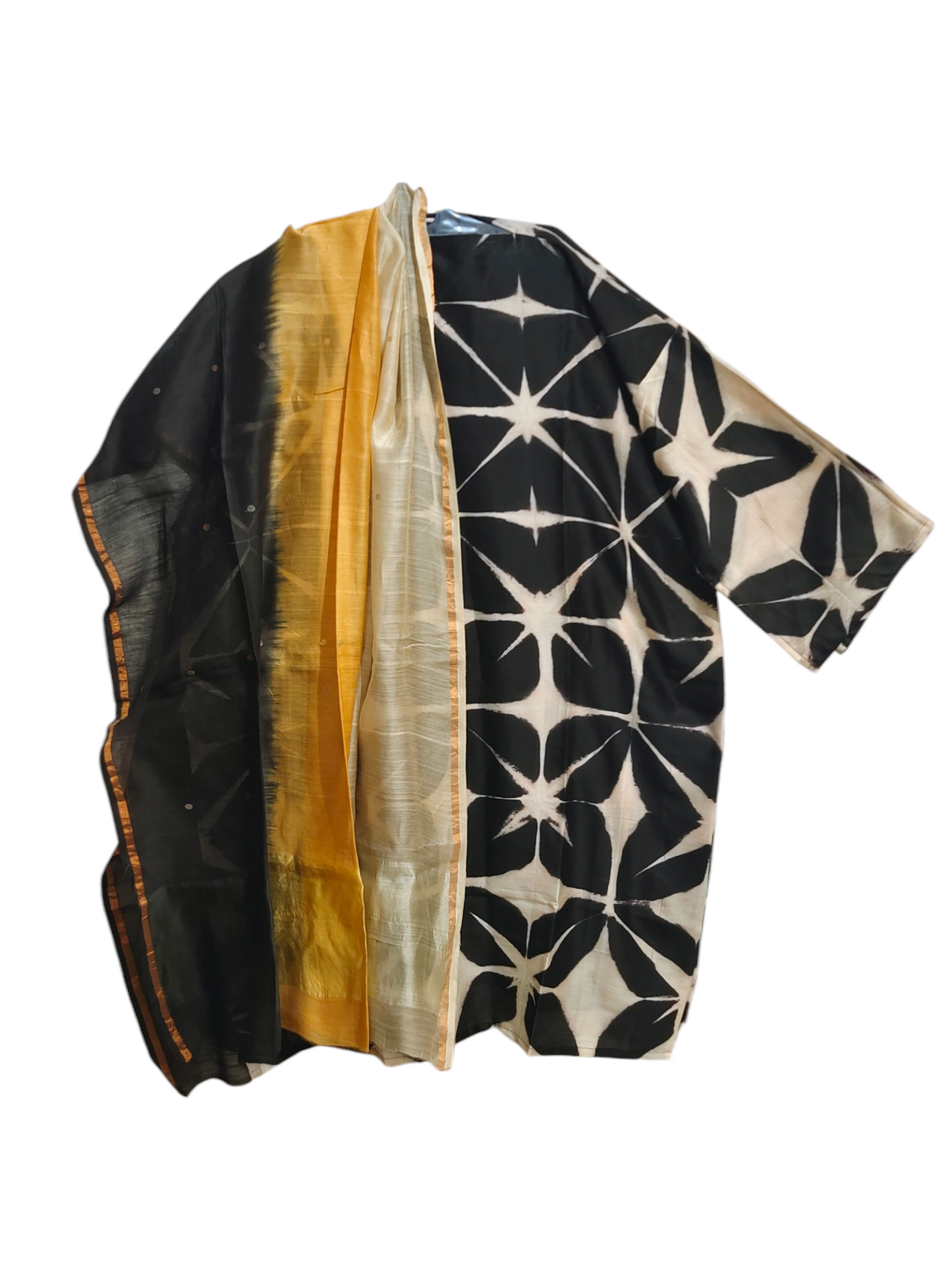 Black and white patterned kurta with gold border on a white background